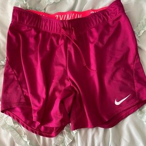 Pink Nike athletic shorts
